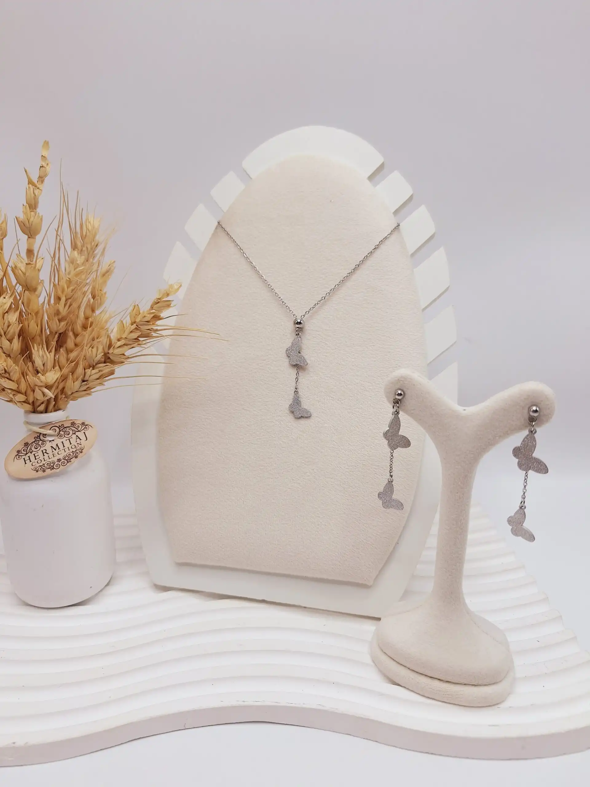 ست گوشواره و گردنبند طرح پروانه نقره ای استیل